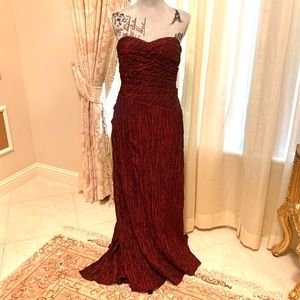 Burgundy strapless formal gown with train. 49 inches long, petite (size 8)